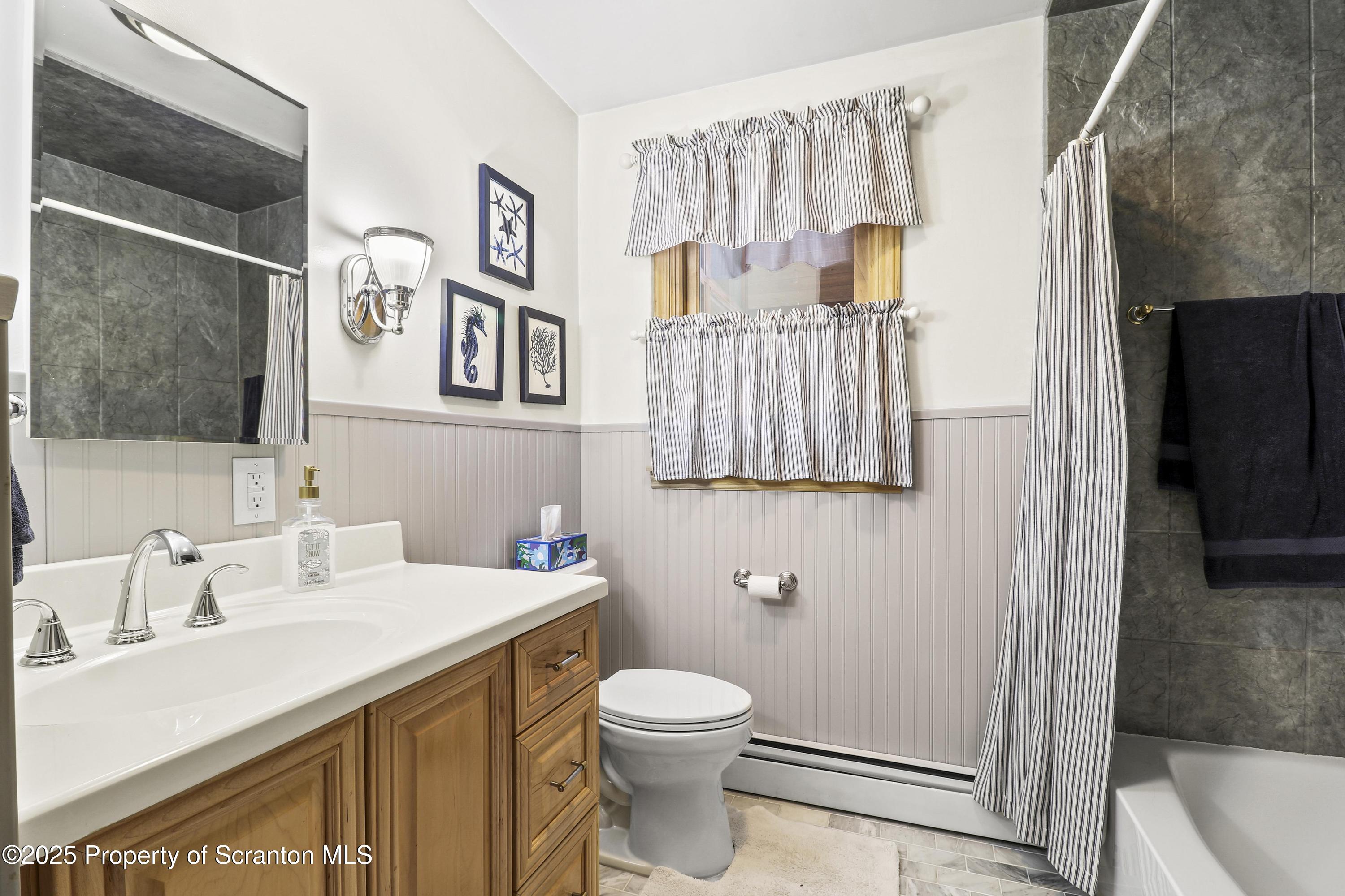 337 Ross Road Dalton, PA 18414 - Photo 23 of 45 a bathroom with a sink a toilet and shower