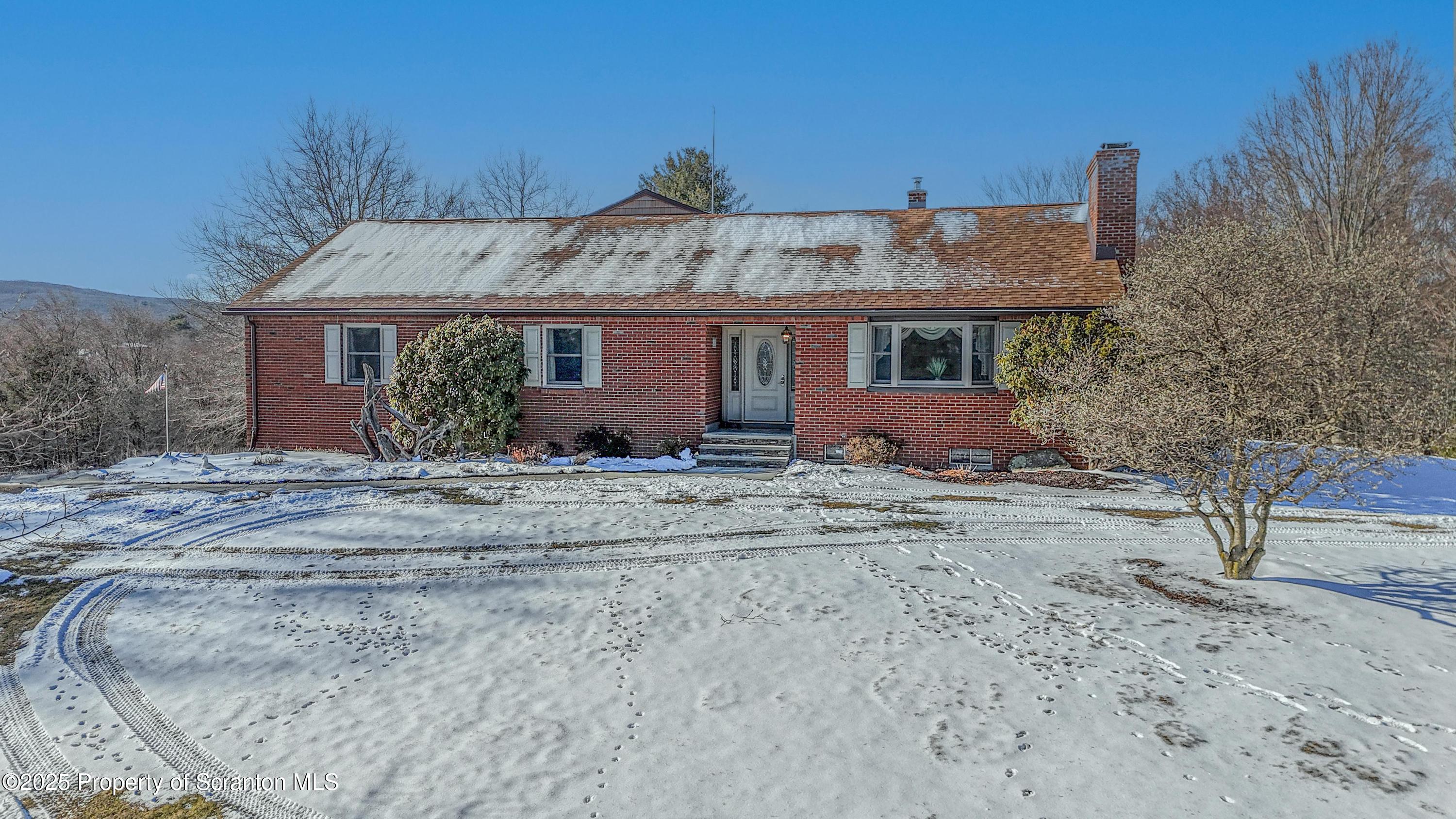 337 Ross Road Dalton, PA 18414 - Photo 3 of 45 front view of a house with a yard