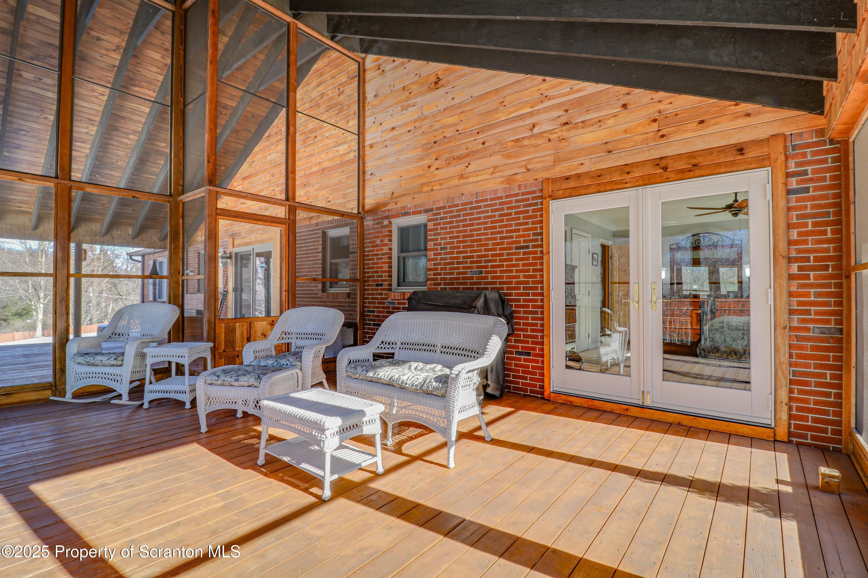 337 Ross Road Dalton, PA 18414 - Photo 31 of 45 a outdoor view with a sitting space and glass windows