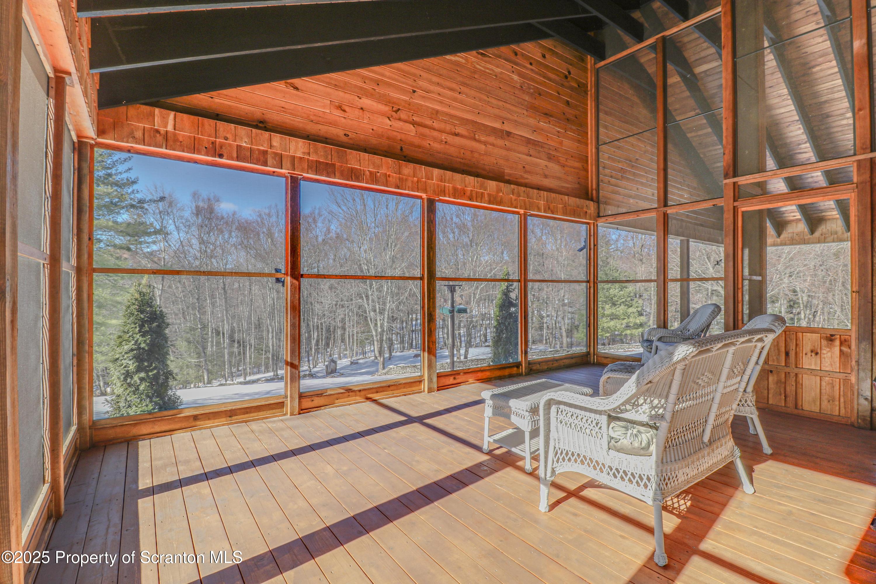 337 Ross Road Dalton, PA 18414 - Photo 33 of 45 a balcony with furniture and wooden floor