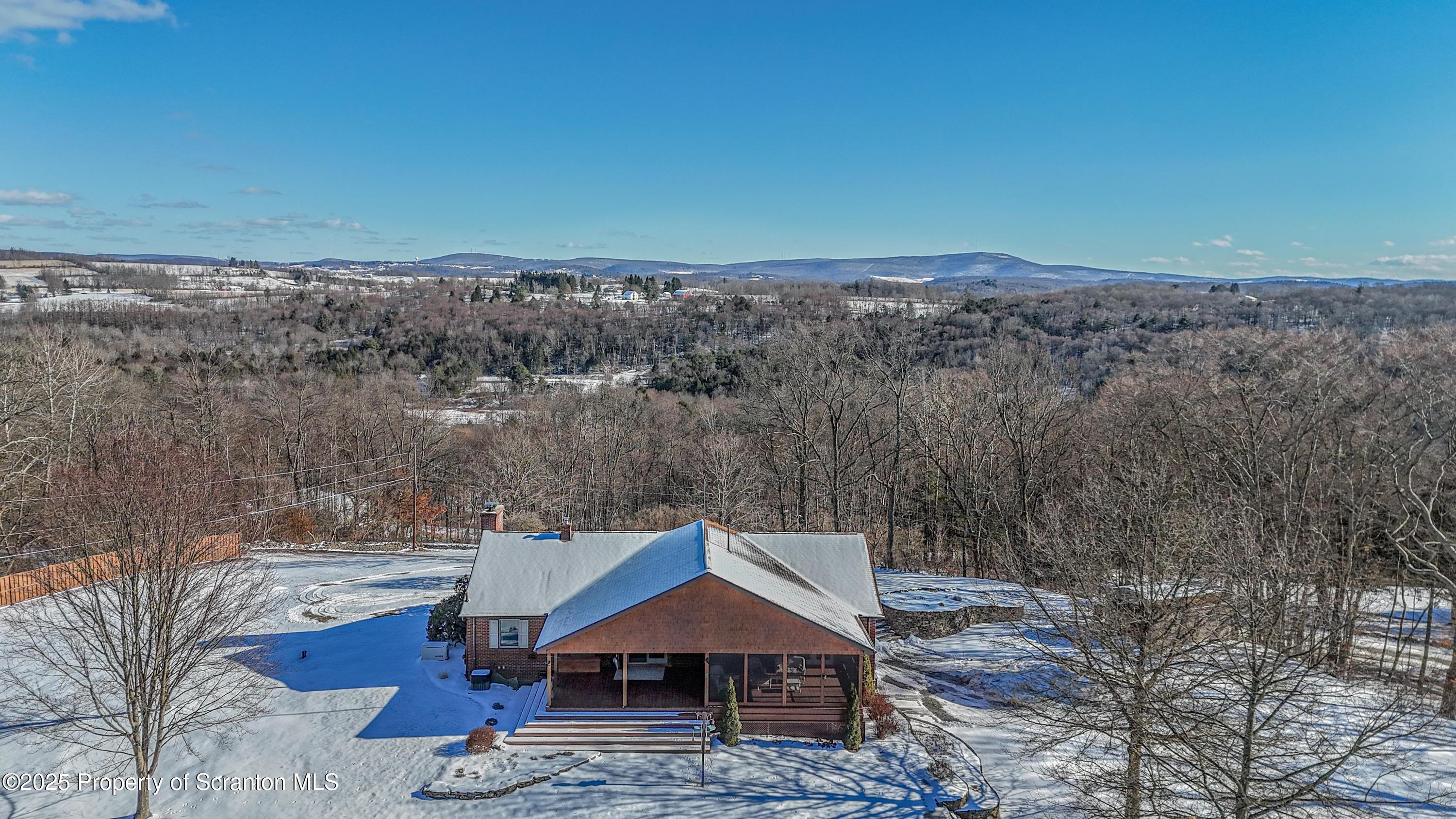 337 Ross Road Dalton, PA 18414 - Photo 42 of 45 a view of a house with a yard