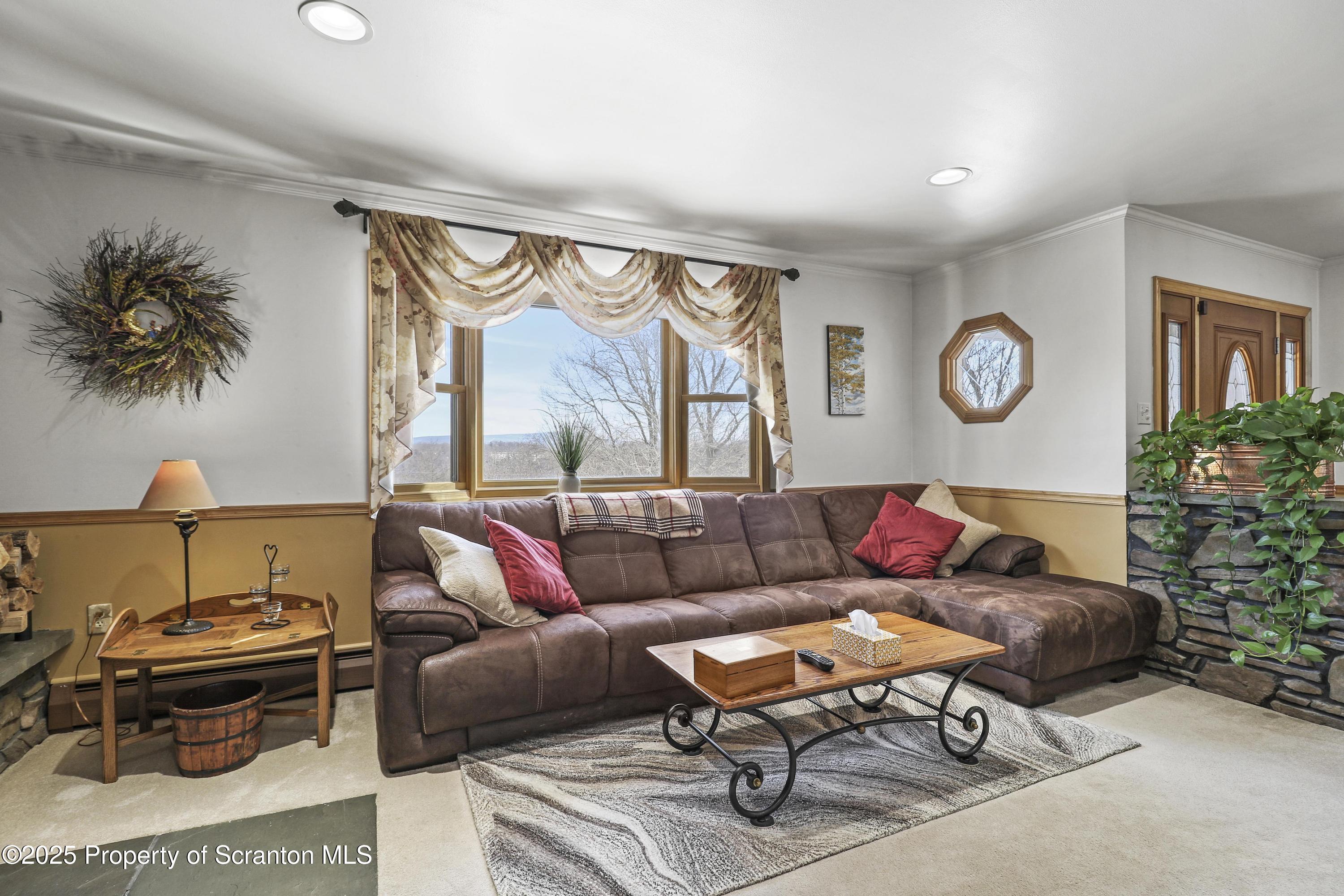 337 Ross Road Dalton, PA 18414 - Photo 6 of 45 a living room with furniture and a large window