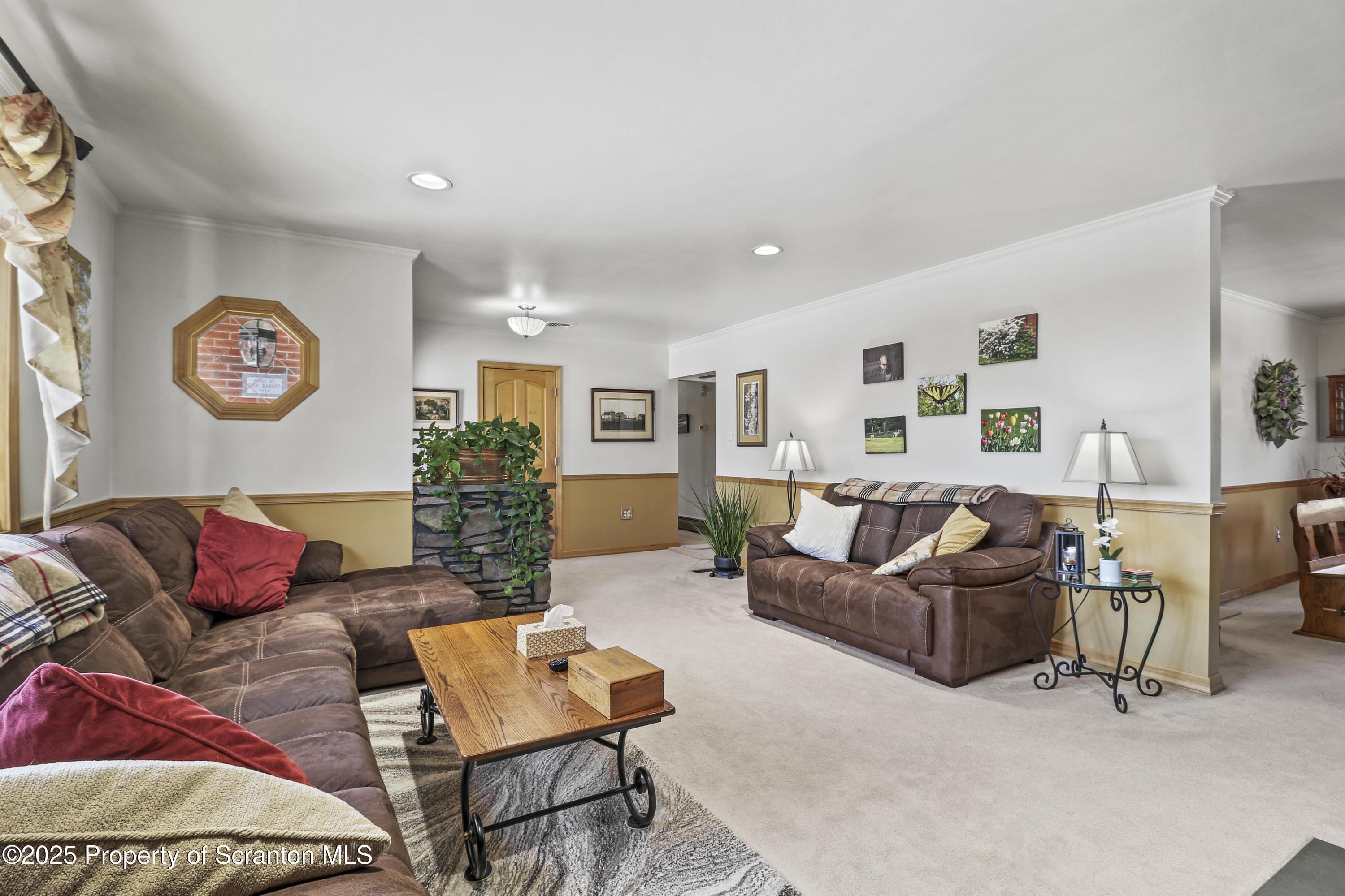 337 Ross Road Dalton, PA 18414 - Photo 7 of 45 a living room with furniture and wall paintings
