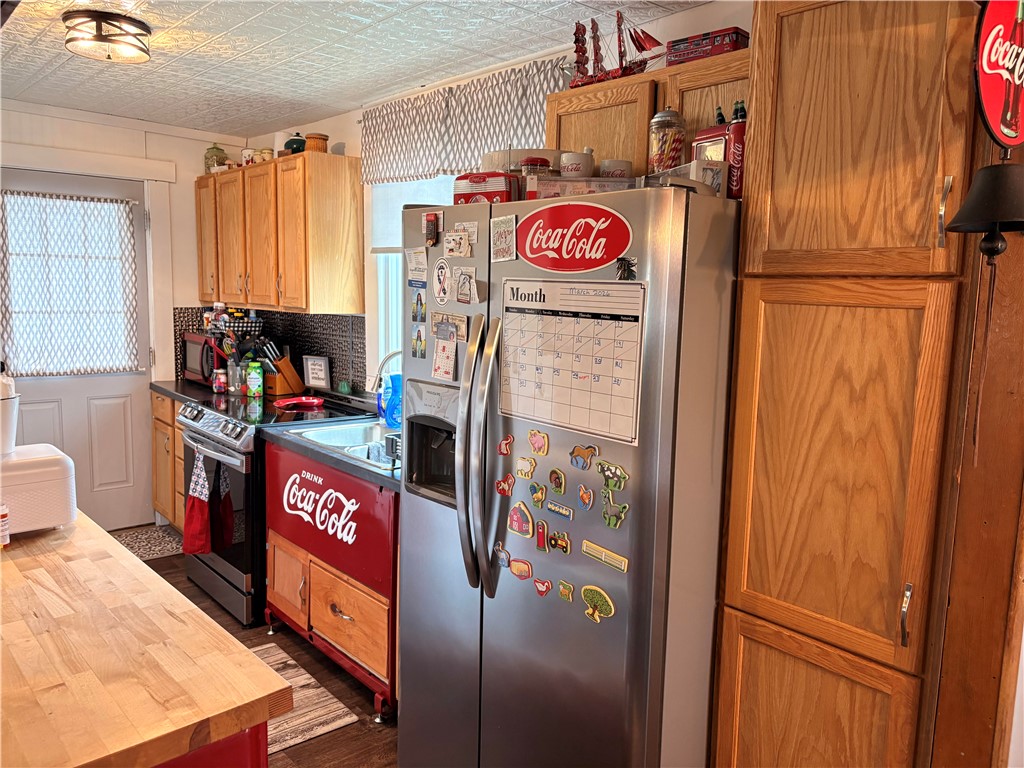 321 Liberty Street Eaton, OH 45320 - Photo 31 of 34 This functional kitchen features ample storage and a classic range, perfect for everyday meals.