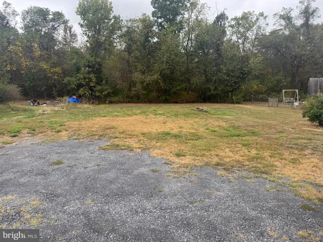 a view of a yard with an outdoor space