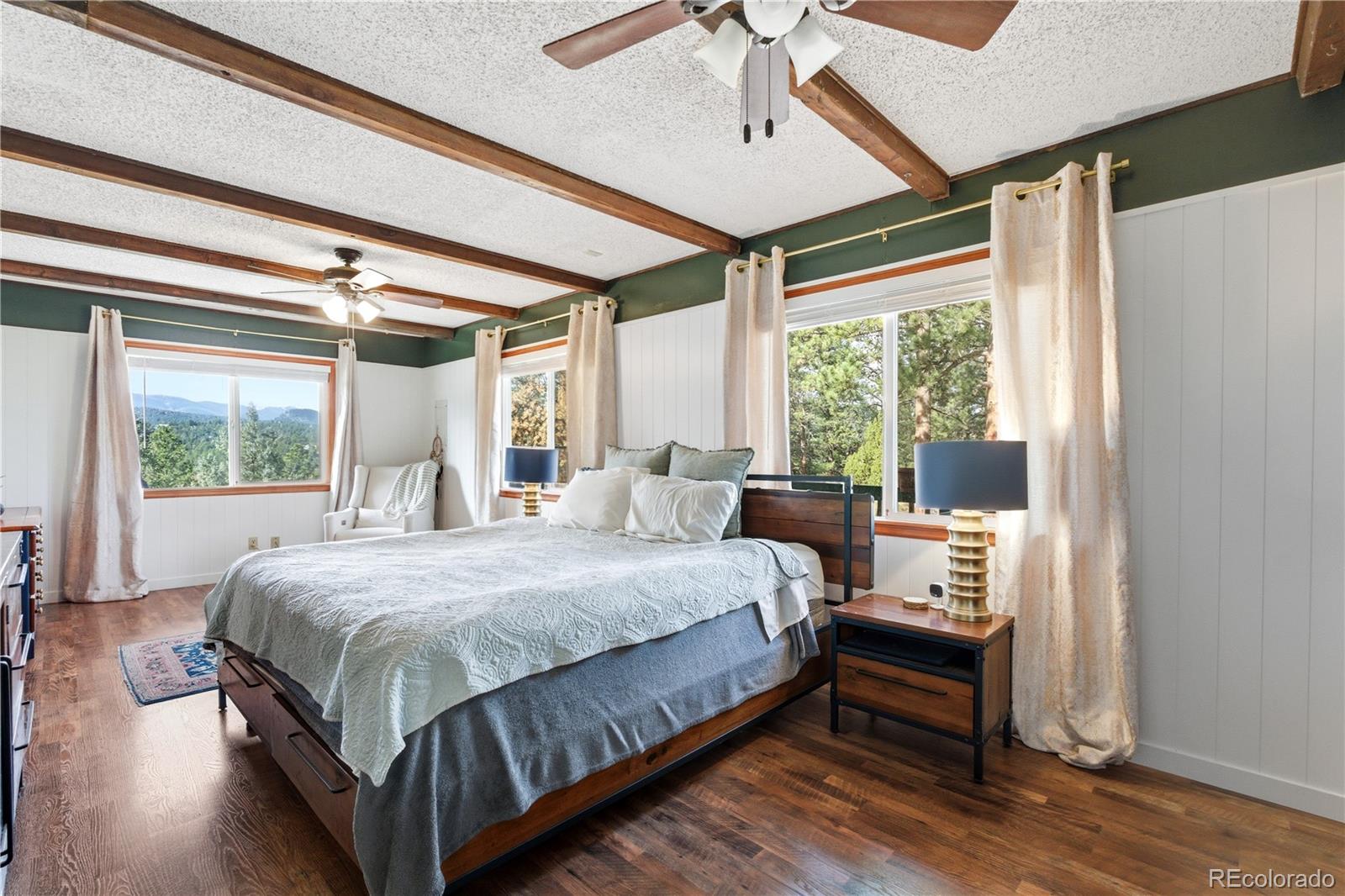 243 Hi Meadow Drive Bailey, CO 80421 - Photo 15 of 37 a bed room with a bed and a window