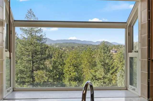 a view of a large window with a yard