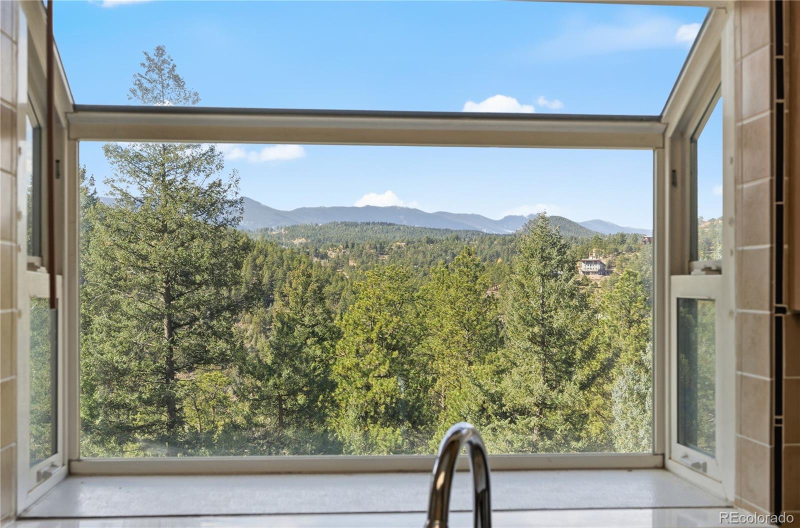 243 Hi Meadow Drive Bailey, CO 80421 - Photo 17 of 37 a view of a large window with a yard
