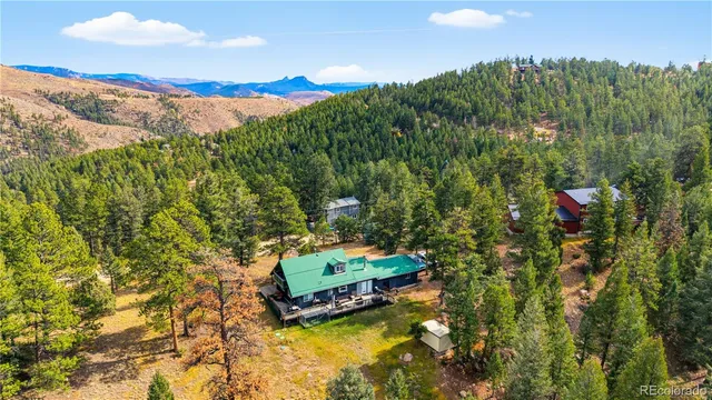 a view of a house with a lounge chairs in a patio
