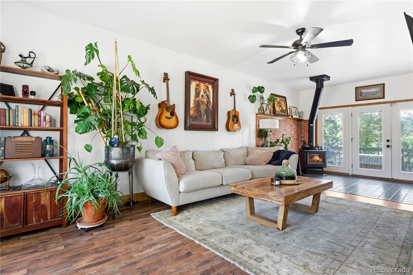 243 Hi Meadow Drive Bailey, CO 80421 - Photo 5 of 37 a living room with patio furniture and a potted plant