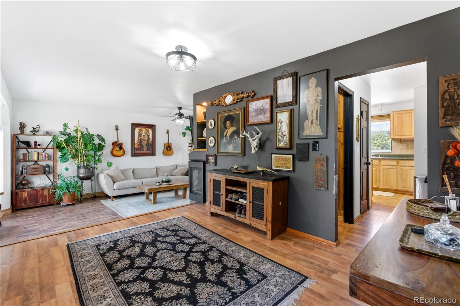 243 Hi Meadow Drive Bailey, CO 80421 - Photo 8 of 37 a living room with furniture and a rug