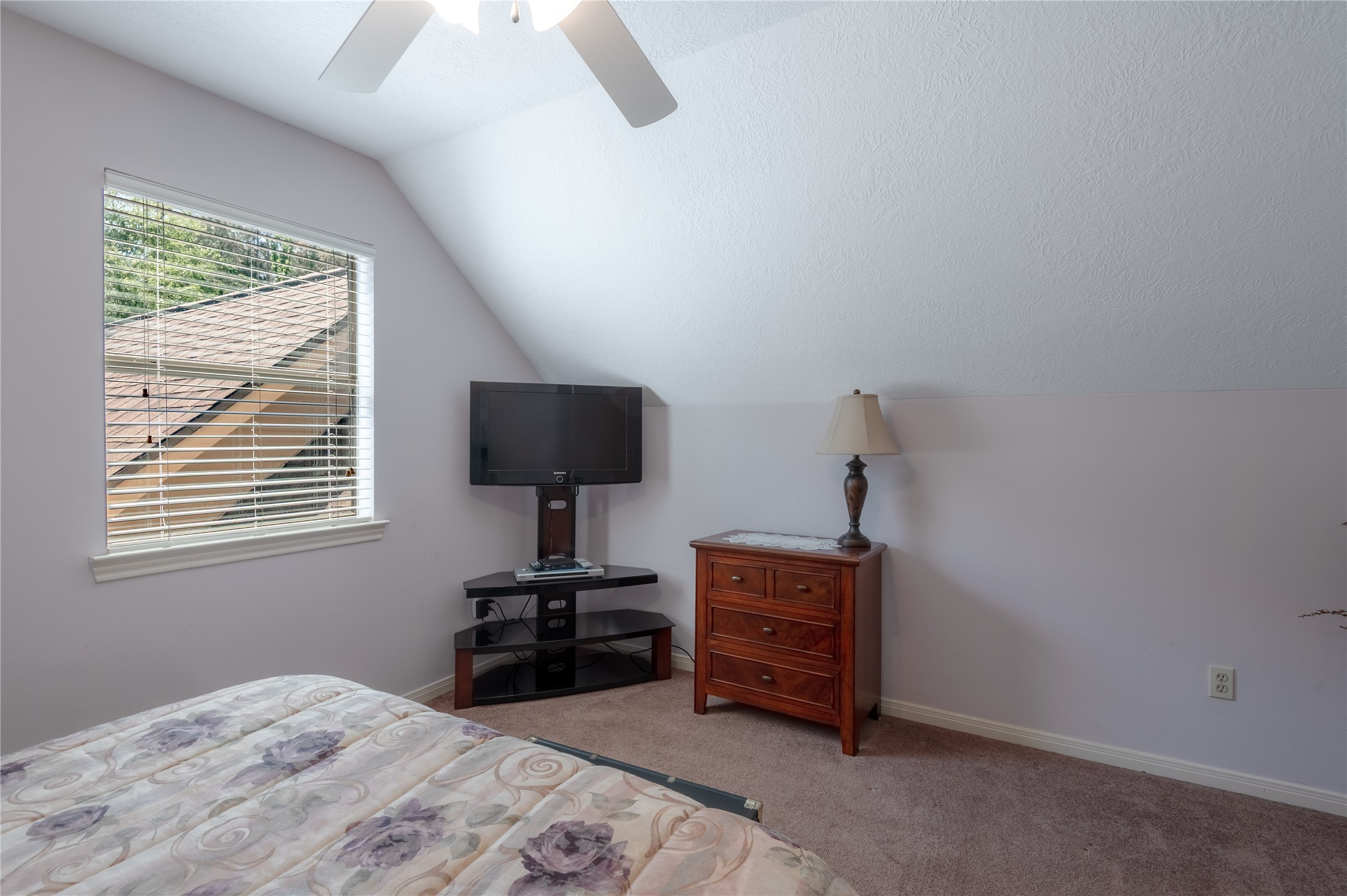 15 Lake Side Trinity, TX 75862 - Photo 27 of 33 a bedroom with a bed and a flat screen tv