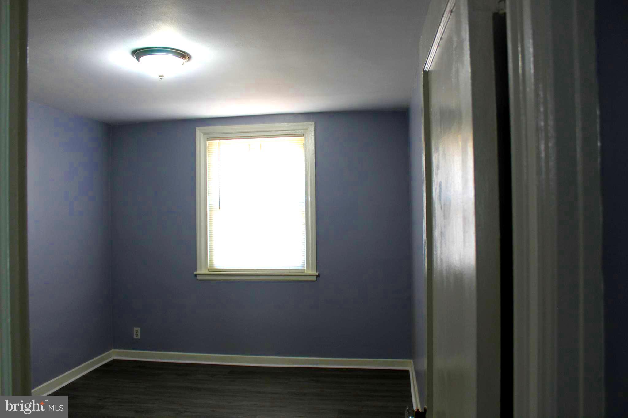 565 East Tabor Road Philadelphia, PA 19120 - Photo 5 of 20 an empty room with a window