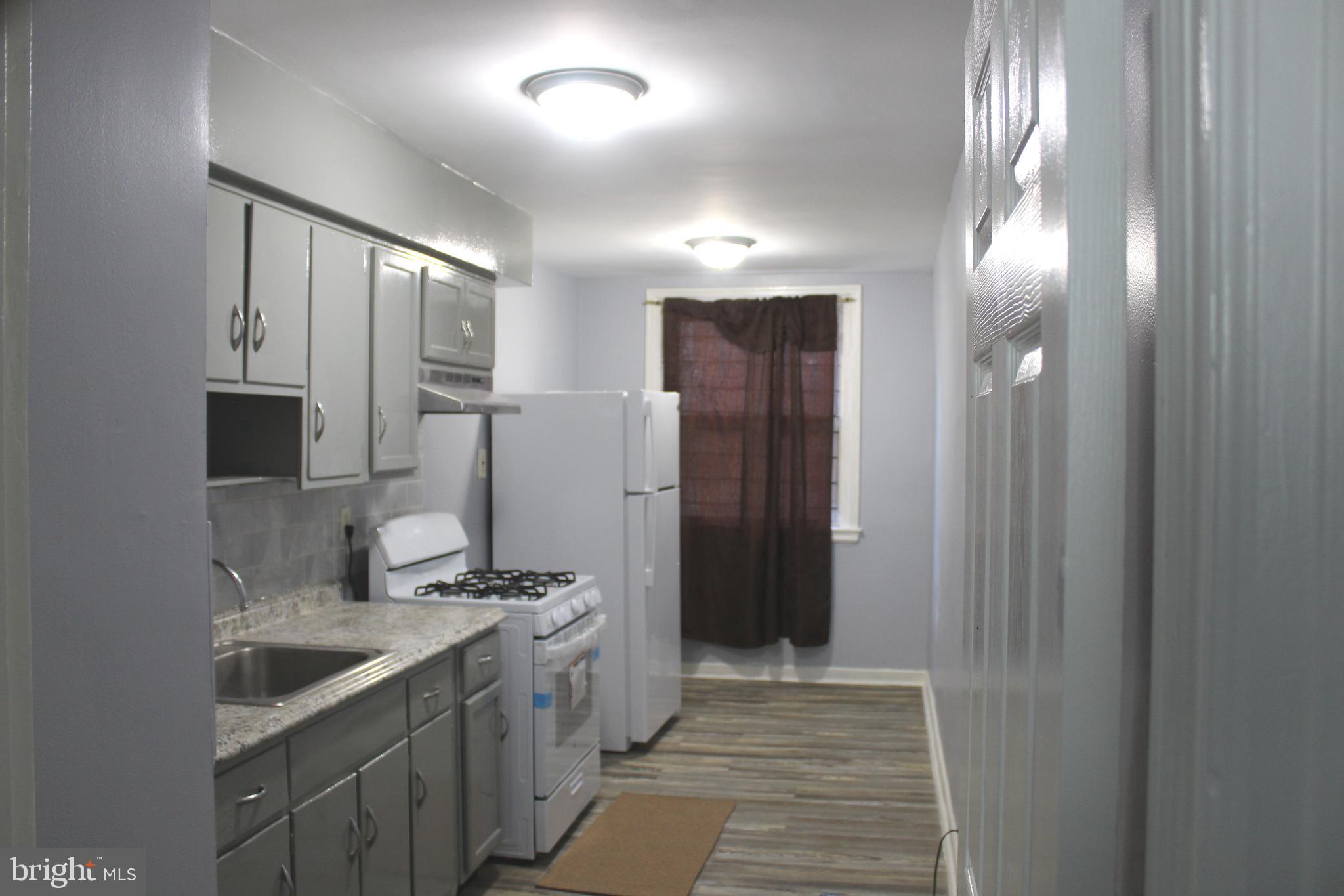565 East Tabor Road Philadelphia, PA 19120 - Photo 9 of 20 a bathroom with a sink and a mirror