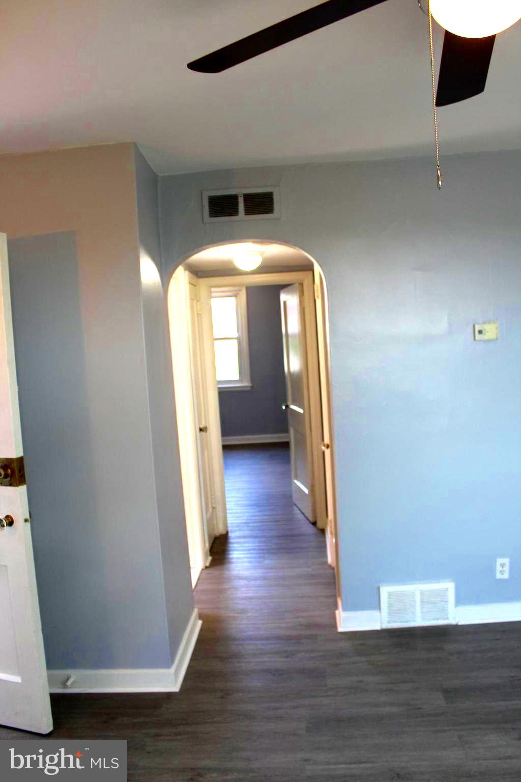 565 East Tabor Road Philadelphia, PA 19120 - Photo 10 of 20 a view of a hallway with wooden floor and staircase