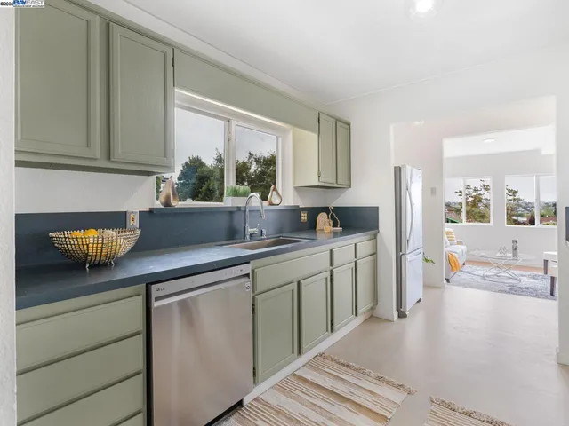 a spacious bedroom with a bed and wooden floor