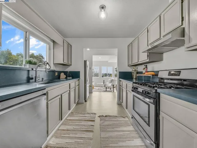 a bed room with two bed and a chair