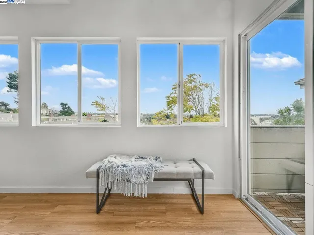 a bathroom with a granite countertop sink a toilet and a mirror