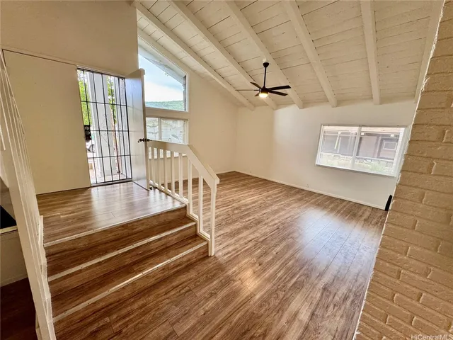 a view of an entryway with wooden floor