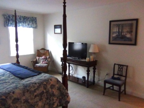 49 Hudson Road Bolton, MA 01740 - Photo 16 of 30 a bedroom with bed and a flat screen tv