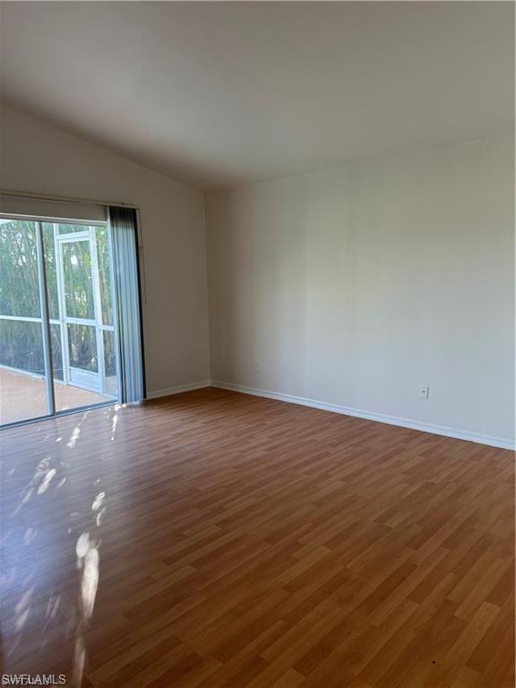21565 Windham Run Estero, FL 33928 - Photo 11 of 23 a view of an empty room with wooden floor and a window