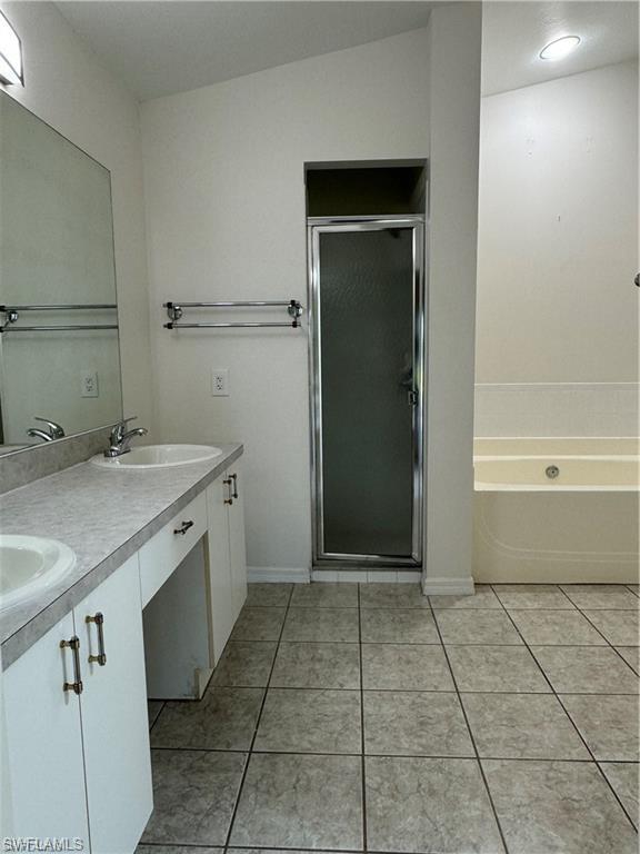 21565 Windham Run Estero, FL 33928 - Photo 12 of 23 a bathroom with a sink a toilet and shower