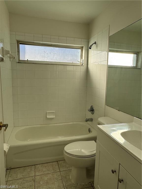 21565 Windham Run Estero, FL 33928 - Photo 14 of 23 a bathroom with a granite countertop bathtub shower sink vanity and toilet