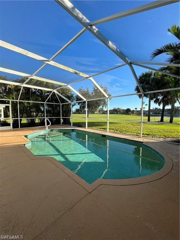 21565 Windham Run Estero, FL 33928 - Photo 16 of 23 a view of a backyard with swimming pool