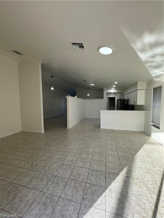 21565 Windham Run Estero, FL 33928 - Photo 10 of 23 a living room with a couch and a coffee table
