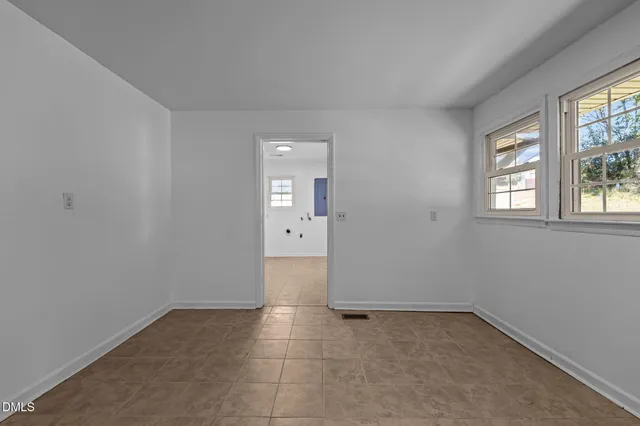 a kitchen with stainless steel appliances granite countertop wooden cabinets a sink and dishwasher