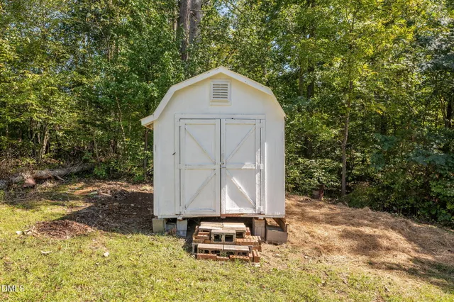 a backyard of a house with a yard and garage