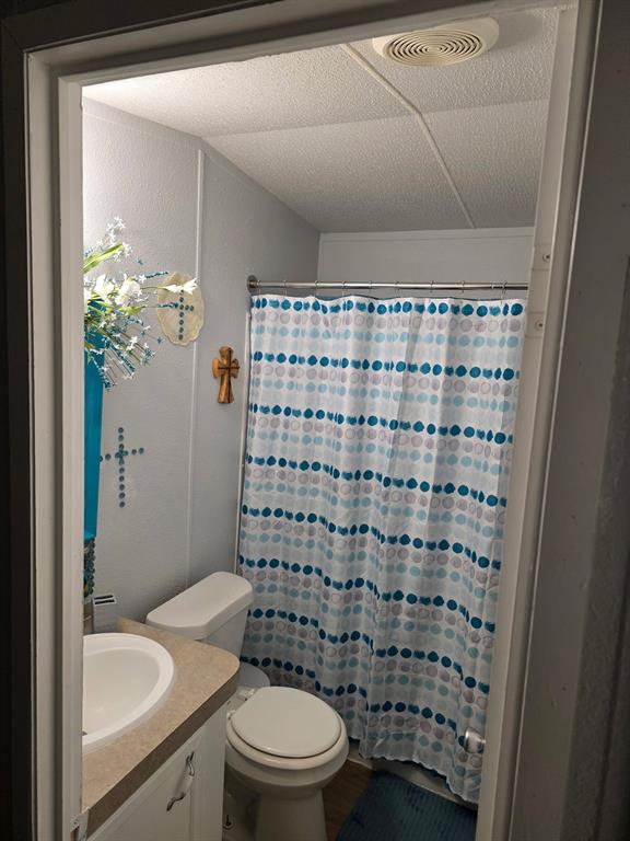 115 Yates Circle Aledo, TX 76008 - Photo 13 of 31 a bathroom with a sink toilet and shower