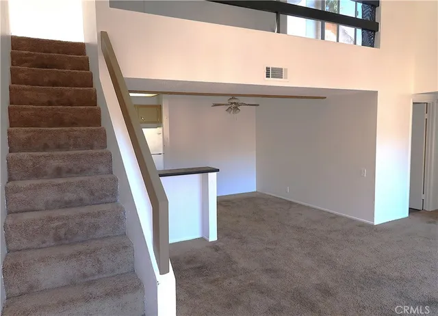 a view of a room with a hallway