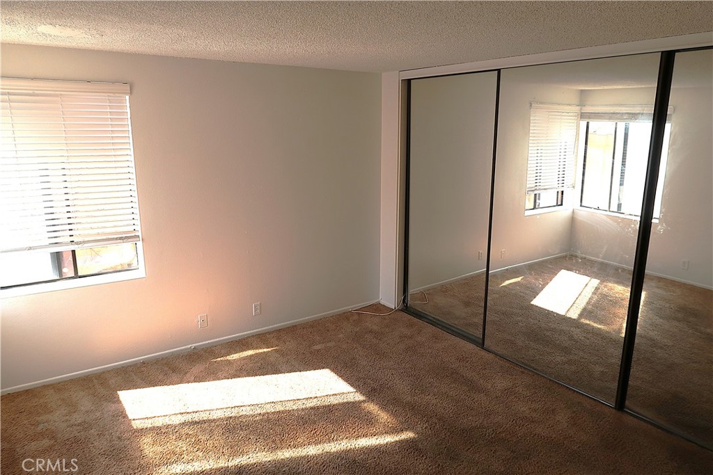 1440 West Edgehill Road, Unit 14 San Bernardino, CA 92405 - Photo 13 of 34 a view of an empty room and window