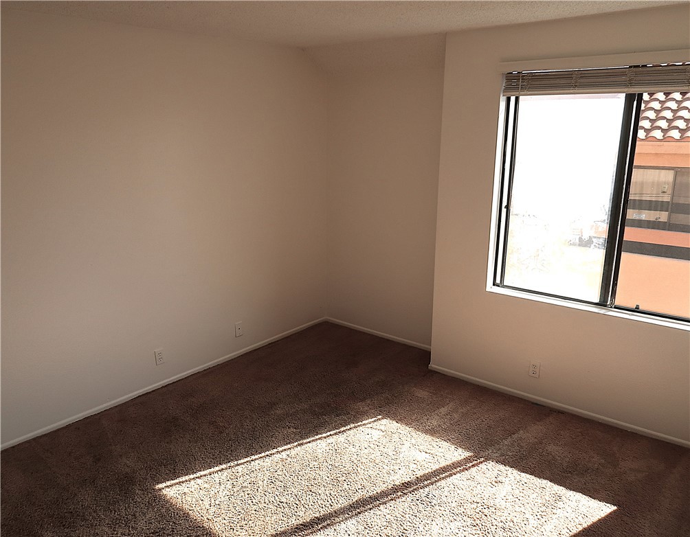 1440 West Edgehill Road, Unit 14 San Bernardino, CA 92405 - Photo 15 of 34 an empty room with a window