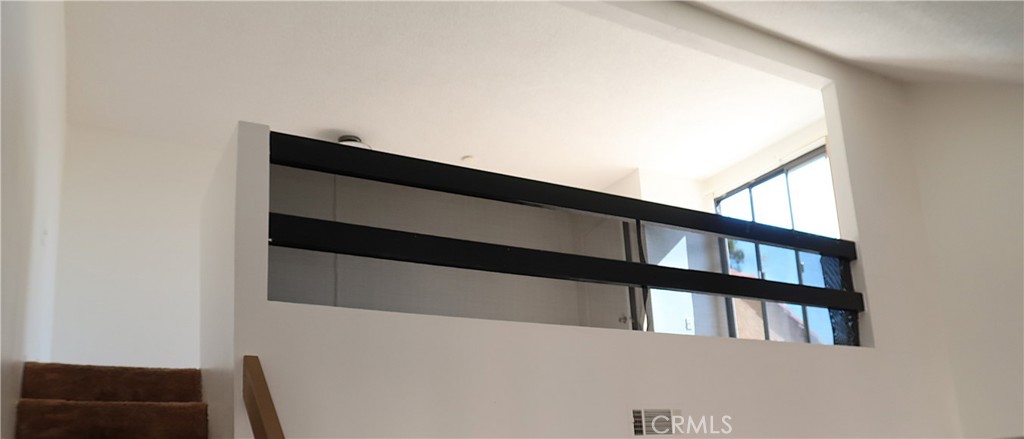 1440 West Edgehill Road, Unit 14 San Bernardino, CA 92405 - Photo 17 of 34 a view of staircase with railing and a window