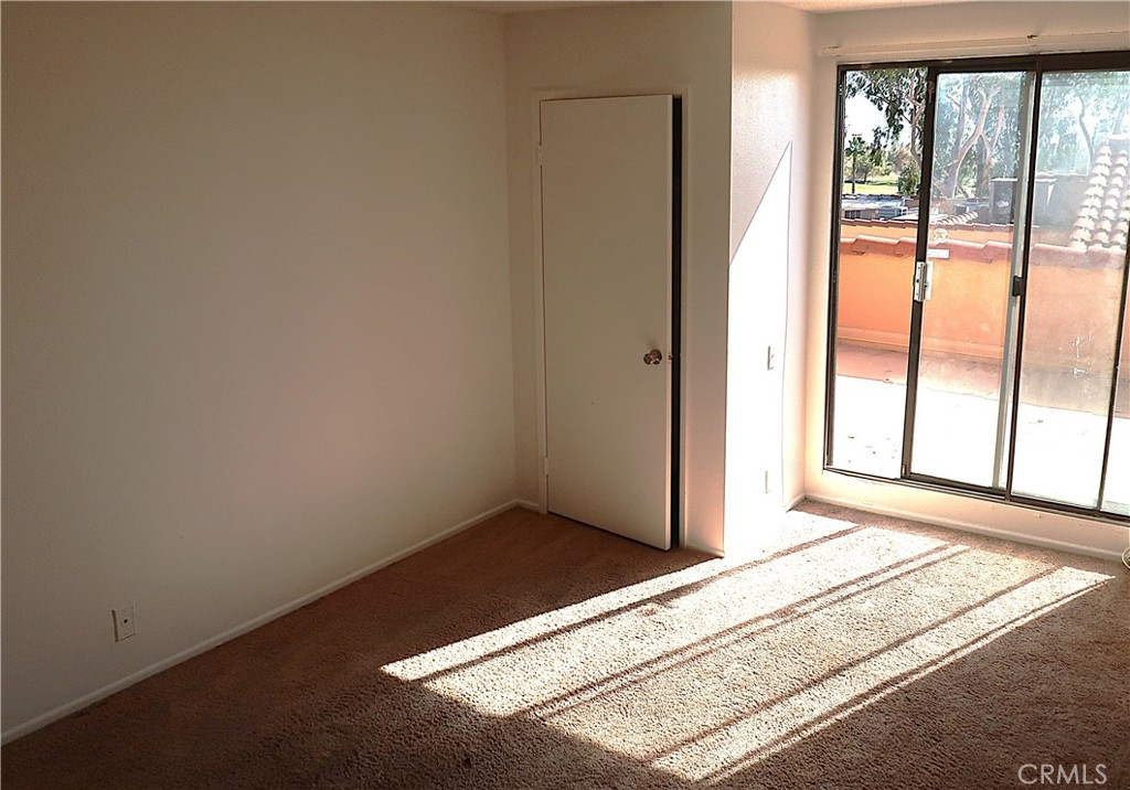 1440 West Edgehill Road, Unit 14 San Bernardino, CA 92405 - Photo 18 of 34 a view of an empty room and window