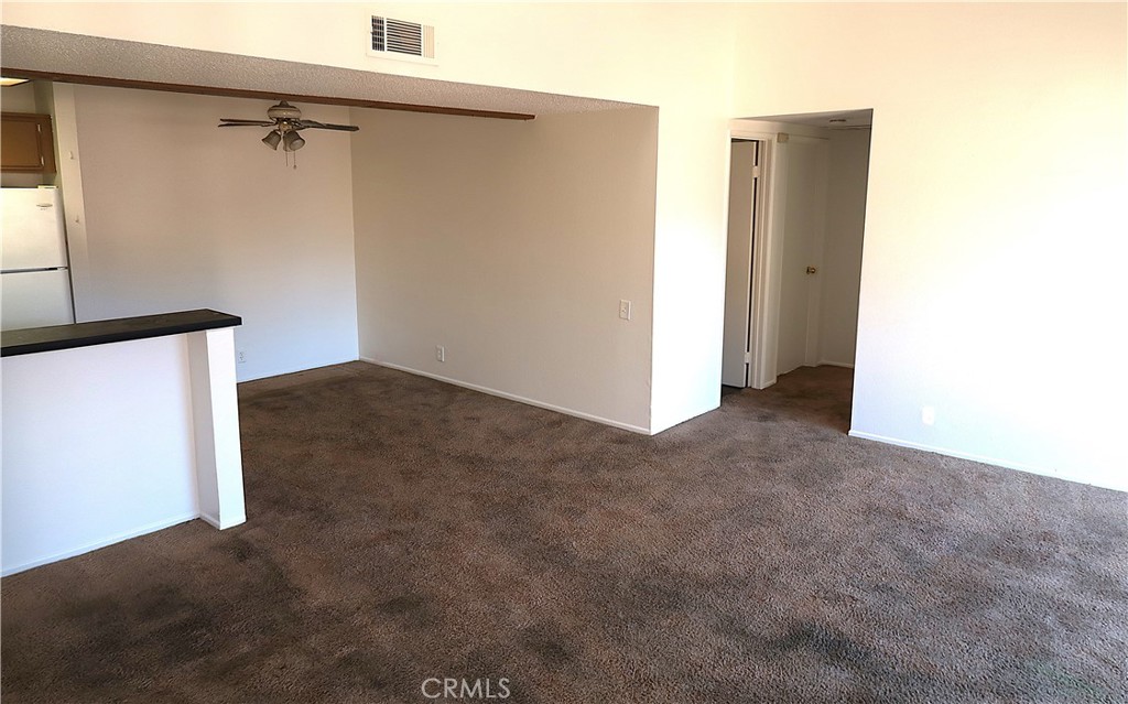 1440 West Edgehill Road, Unit 14 San Bernardino, CA 92405 - Photo 2 of 34 a view of a room with a hallway