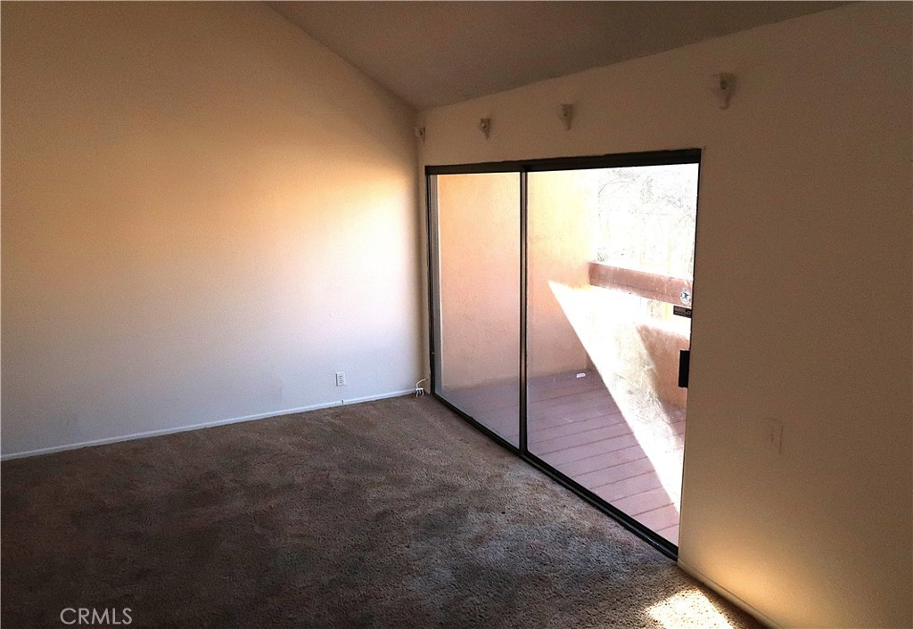 1440 West Edgehill Road, Unit 14 San Bernardino, CA 92405 - Photo 8 of 34 a view of an empty room with a window