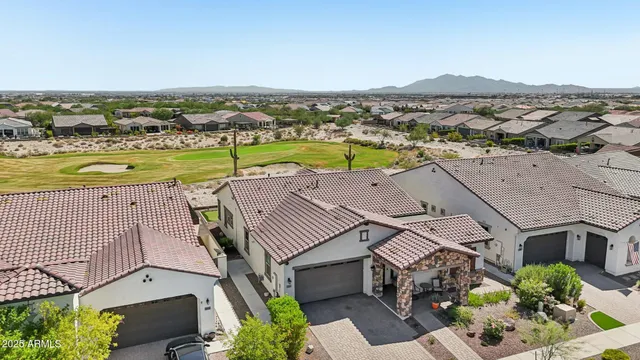 an aerial view of a house with a garden