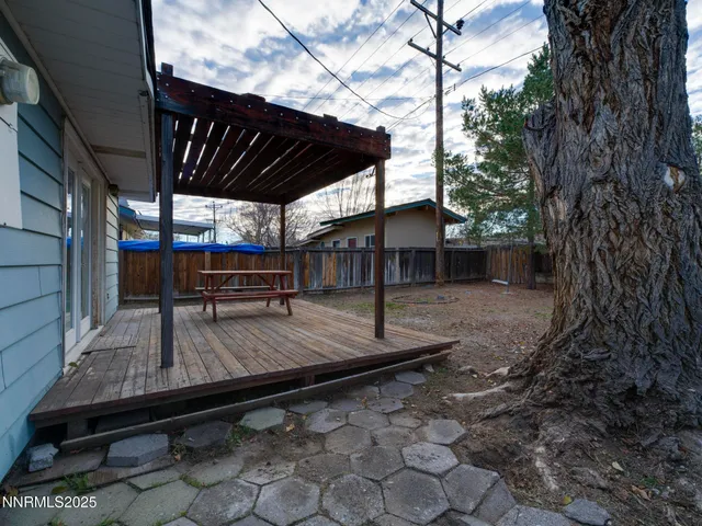 a view of a backyard with sitting area