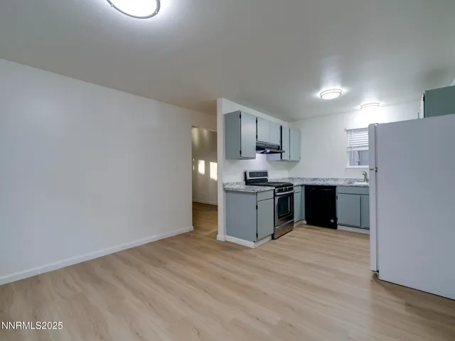 a kitchen with stainless steel appliances a refrigerator and a sink
