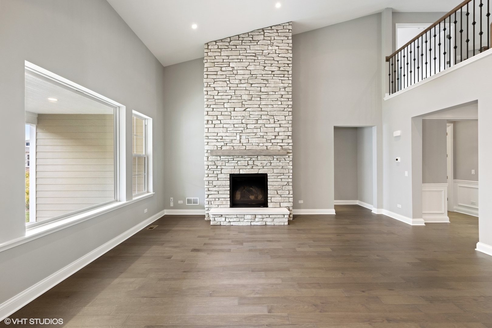 310 Arabian Circle Willowbrook, IL 60527 - Photo 11 of 36 a view of an empty room with a fireplace and a window