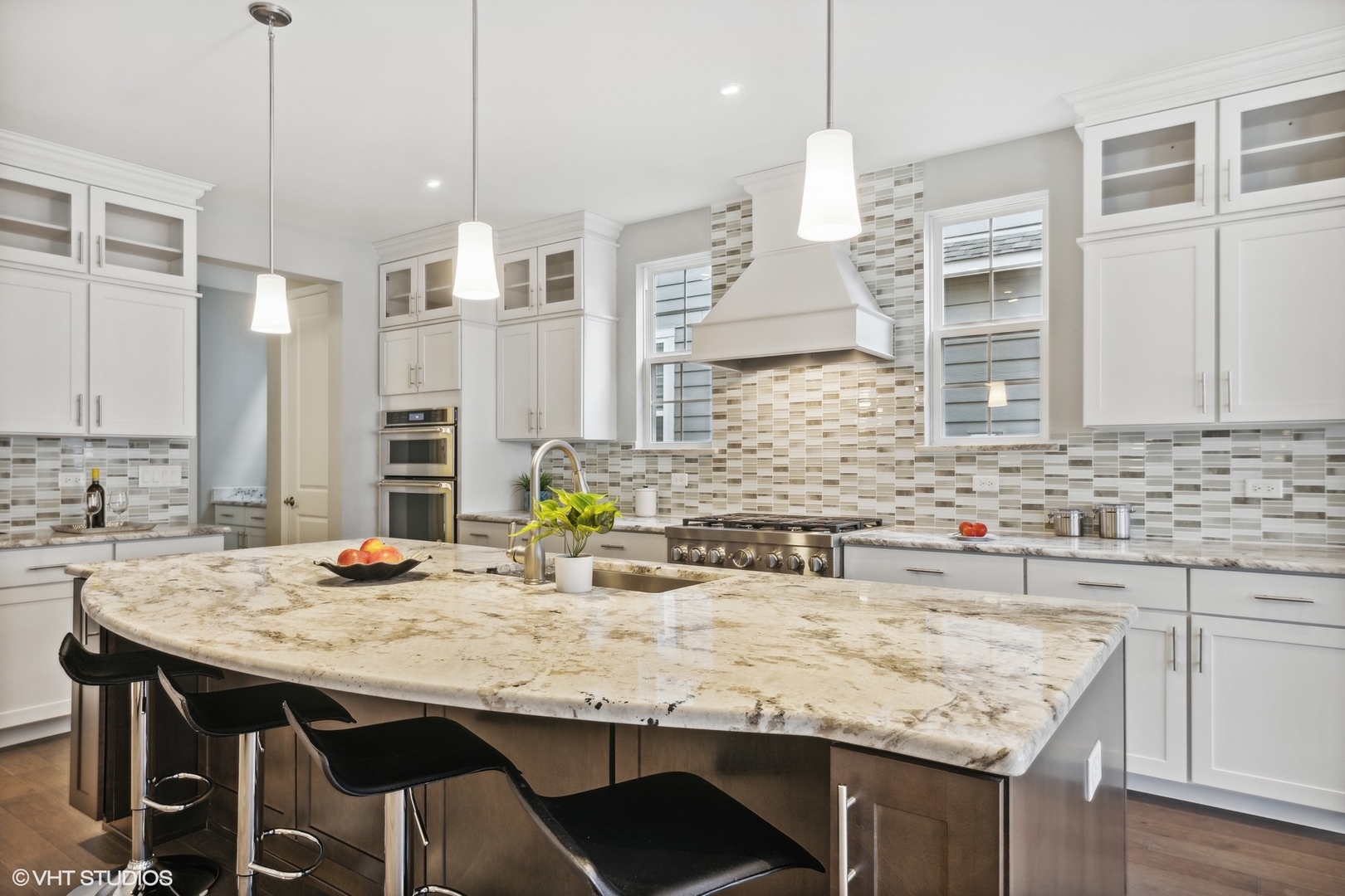 310 Arabian Circle Willowbrook, IL 60527 - Photo 13 of 36 a kitchen with granite countertop kitchen island stainless steel appliances a sink stove and kitchen island