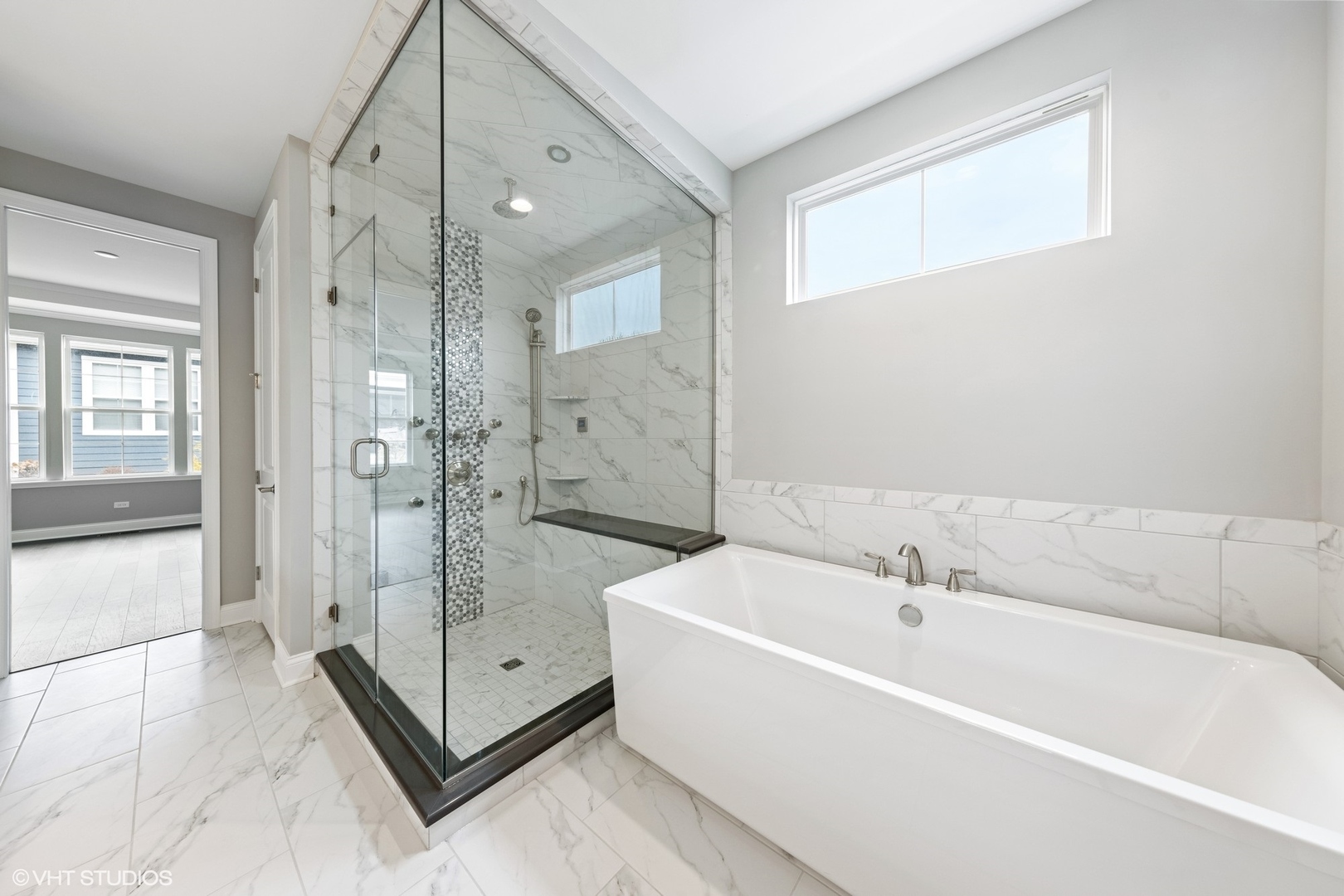 310 Arabian Circle Willowbrook, IL 60527 - Photo 18 of 36 a bathroom with a tub shower vanity and sink