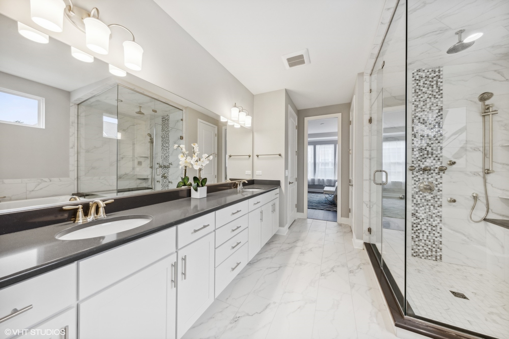 310 Arabian Circle Willowbrook, IL 60527 - Photo 19 of 36 a large bathroom with a granite countertop double vanity sink a mirror and a shower
