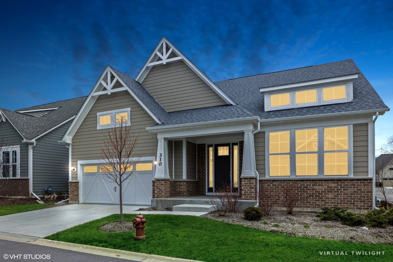 310 Arabian Circle Willowbrook, IL 60527 - Photo 2 of 36 a front view of a house with garden