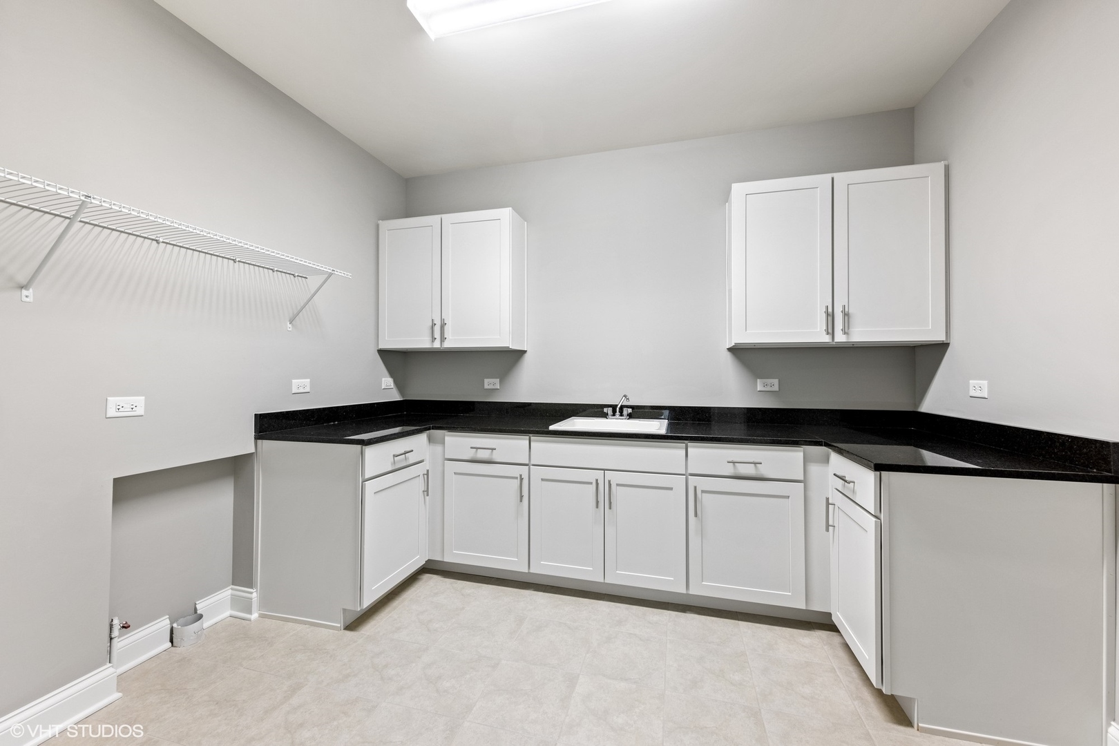310 Arabian Circle Willowbrook, IL 60527 - Photo 27 of 36 a kitchen with granite countertop white cabinets and a sink