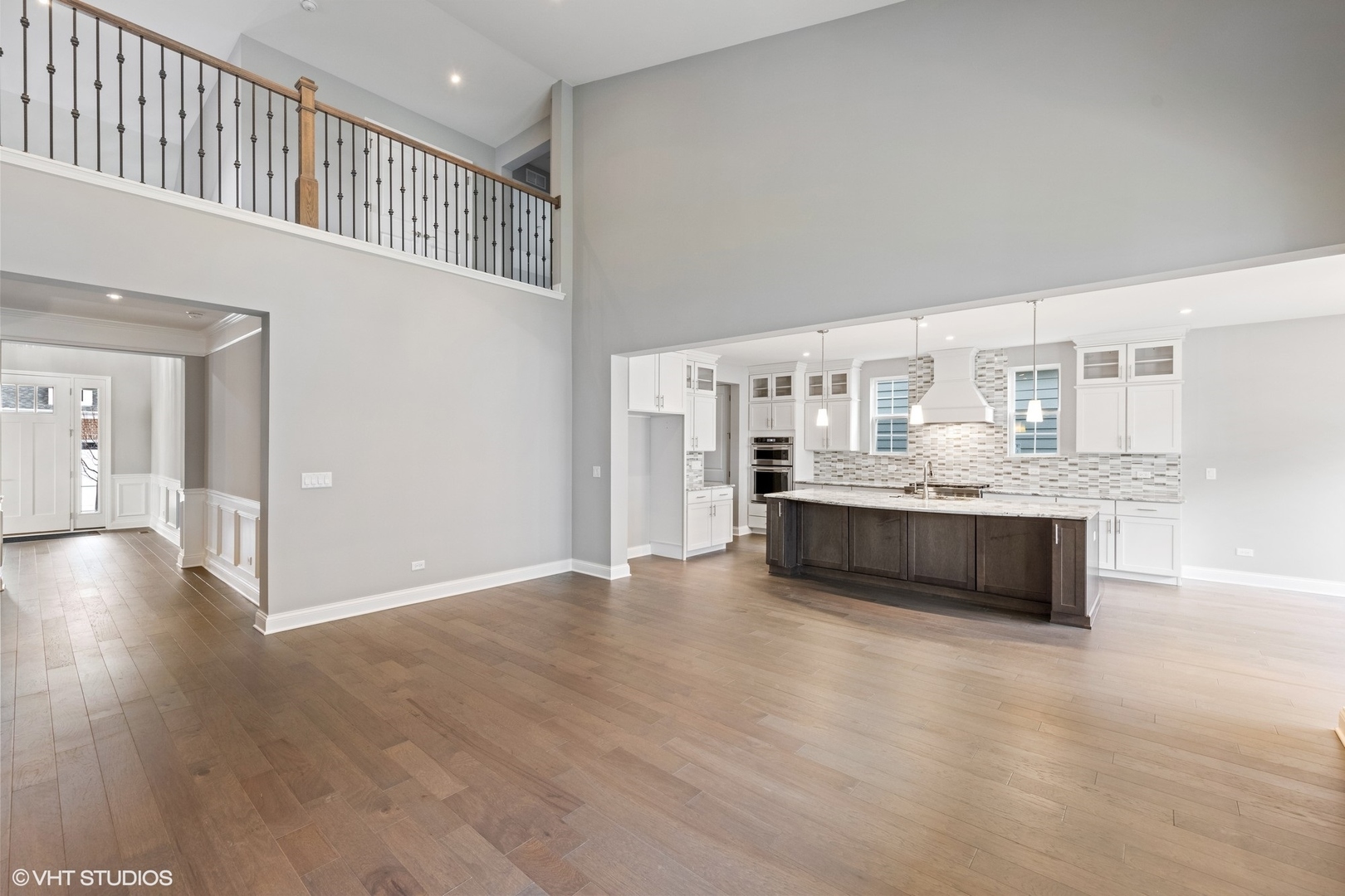 310 Arabian Circle Willowbrook, IL 60527 - Photo 9 of 36 a living room with stainless steel appliances kitchen island granite countertop a refrigerator a stove a sink dishwasher and white cabinets with wooden floor