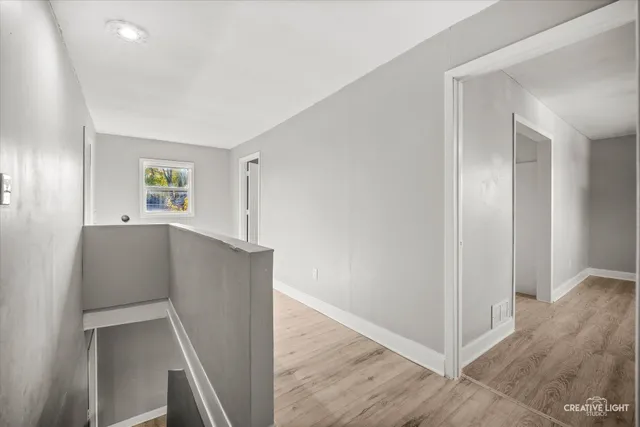 a view of livingroom with hardwood and hallway